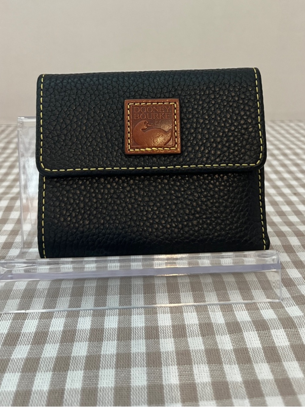 Black Dooney And Bourke Pebble Leather Small Flap Wallet with Yellow Stitching